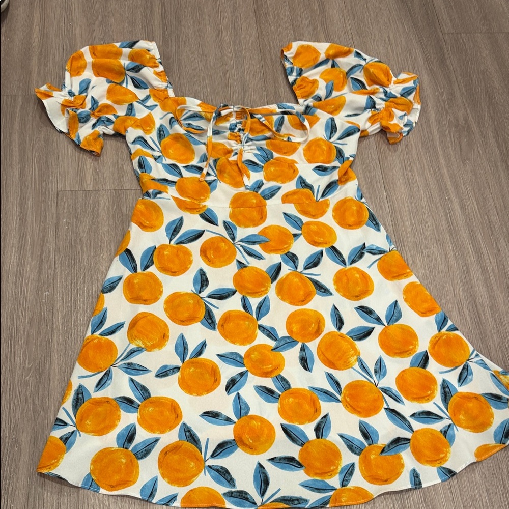 White sundress with oranges